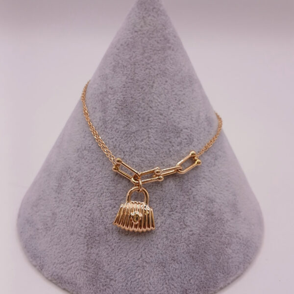 تصویر دستبند تیفانی طرح آویز کیف 1 | خرید بهترین و جدید ترین طرح های طلا و جواهر در پرنس تهران بهترین قیمت با پرنس تهران